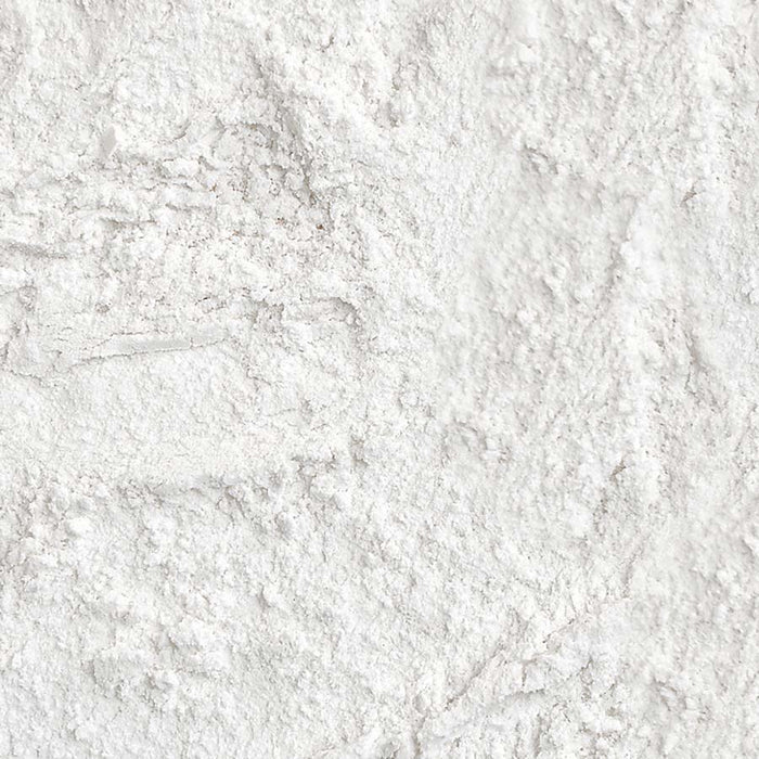 Close-up texture swatch of Palladio 4Ever + Ever Mattifying Loose Setting Powder showing fine white translucent powder texture
