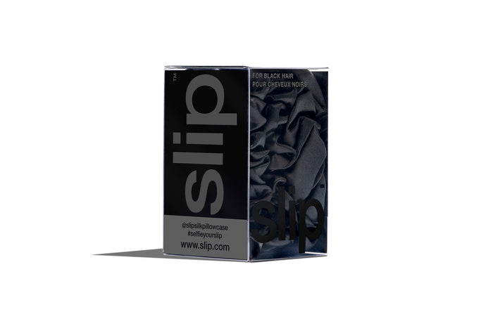 A set of three black slipsilk scrunchies, including two midi and one large, in branded packaging on a white background.