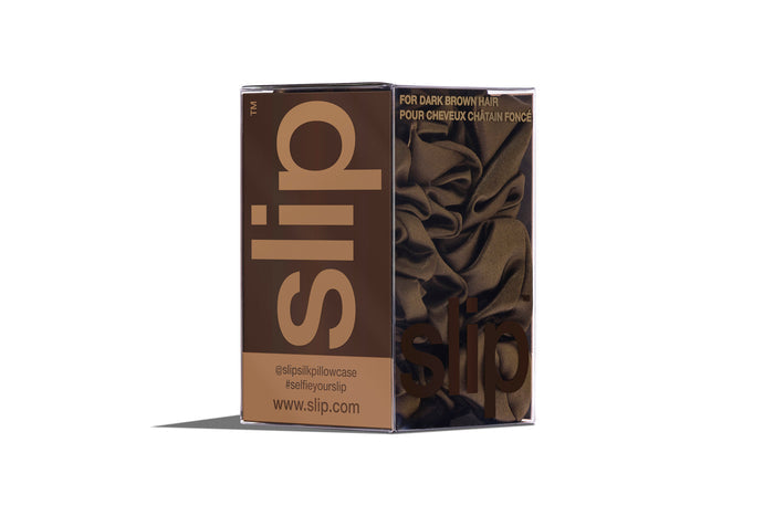 A set of three dark brown slipsilk scrunchies, including two midi and one large, in branded packaging on a white background.