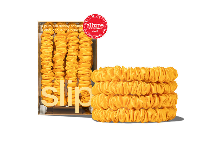 Set of vibrant yellow skinny scrunchies from the "Back to School" collection with Slip packaging on a white background