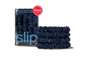 Set of navy skinny scrunchies from the "Back to School" collection with Slip packaging on a white background.