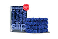 Blue silk hair scrunchies with packaging and 'Allure' award logo on a white background