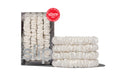 A set of four white silk skinny scrunchies displayed in a box and stacked in front with a allure award badge on a white background