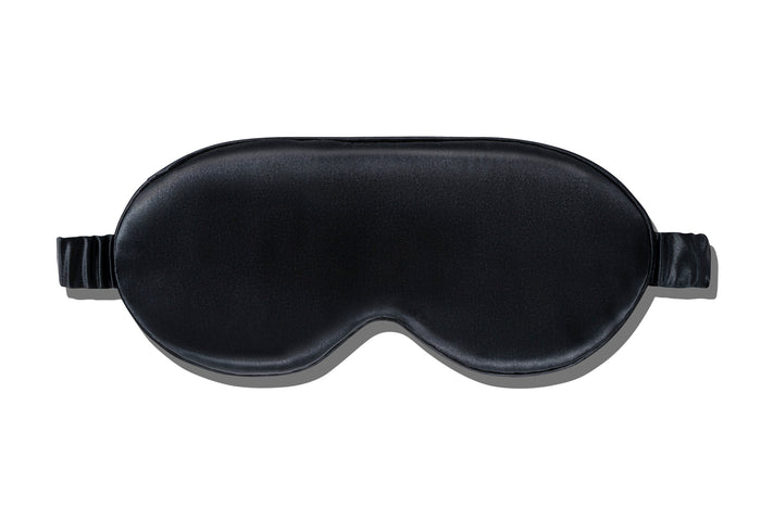 A black slip silk contour sleep mask on white background.
