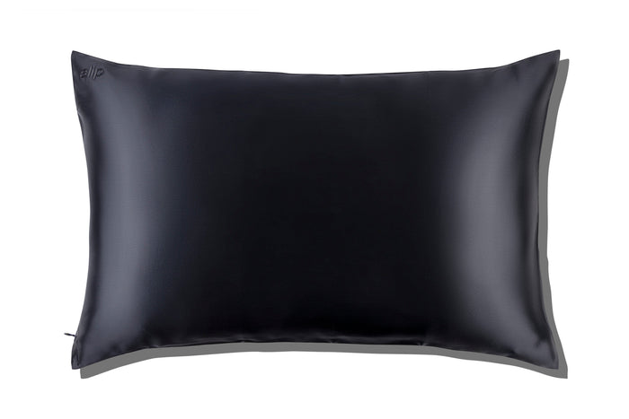 A black slip silk king pillowcase on a white background.
