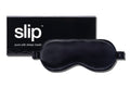 A black slip silk sleep mask with branded box on a white background.