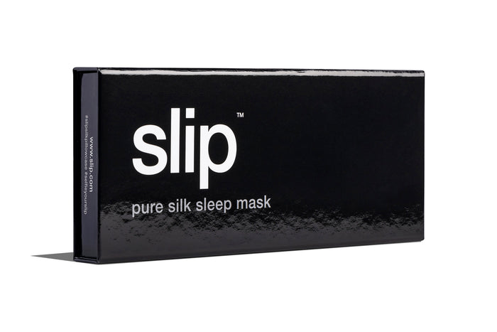 A caramel slip silk sleep mask branded box on a white background.