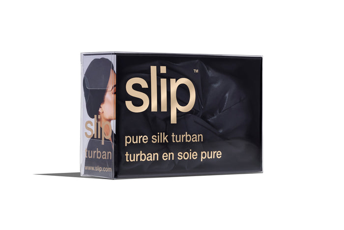 A black slip silk turban branded packaging on a white background.