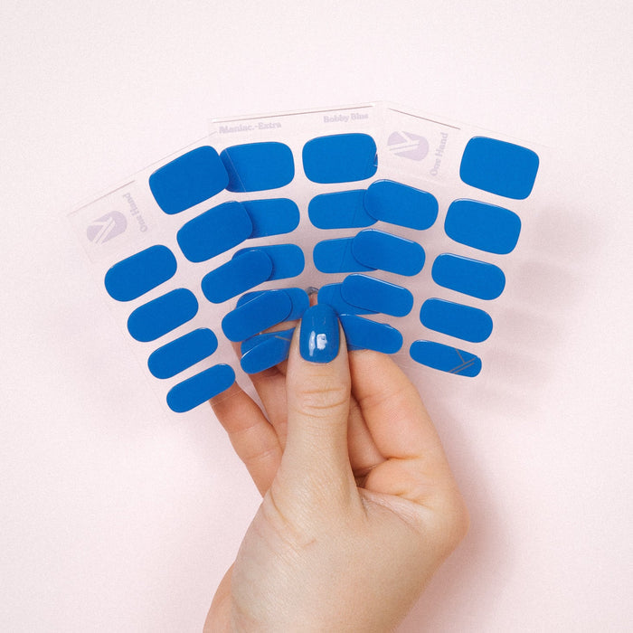 Bobby blue Maniac Nails bright blue gel stickers on sheet and hand