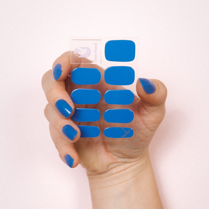 Bobby Blue Maniac nails bright blue gel stickers on hand and sheet