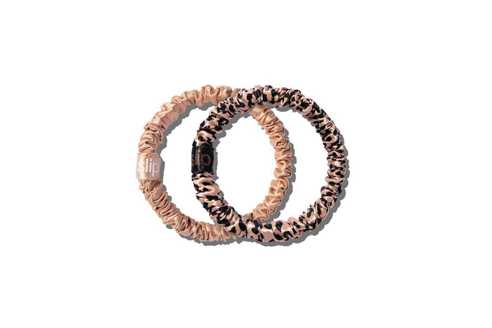 Two slip silk skinny scrunchies, one rose gold and one rose gold leopard, on a white background.