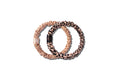 Two slip silk skinny scrunchies, one rose gold and one rose gold leopard, on a white background.