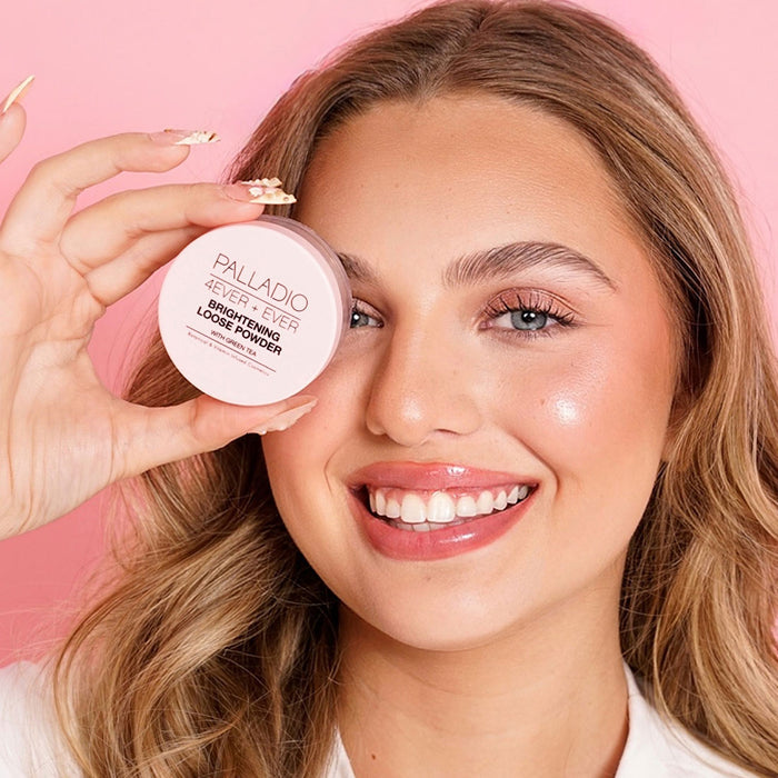Model holding Palladio 4Ever + Ever Brightening Loose Powder jar in front of her eye, showcasing radiant glowing skin