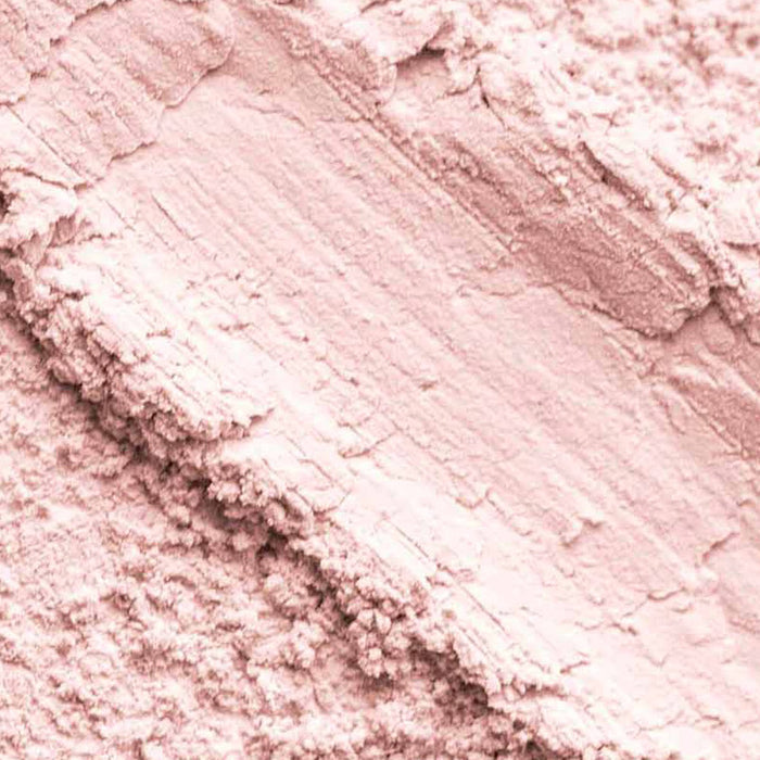 Close-up texture swatch of Palladio 4Ever + Ever Brightening Loose Powder showing shimmery pink powder texture