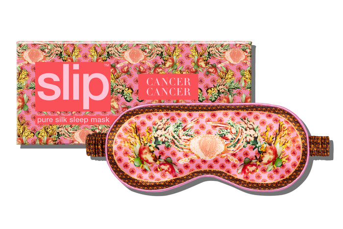 Packaging and silk sleep mask with crab motifs and floral patterns, predominantly pink and yellow, with the brand 'slip' visible.