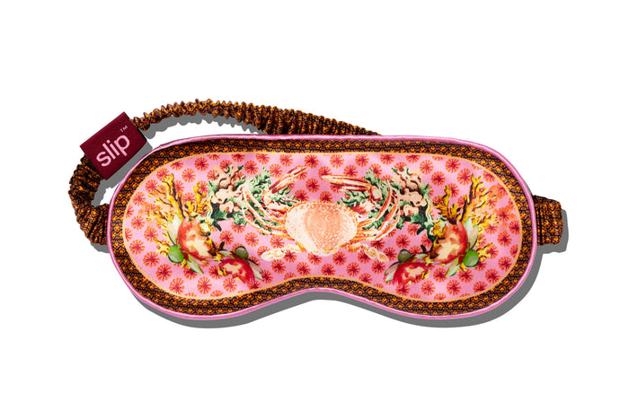A floral patterned slip silk sleep mask with Cancer star sign details.