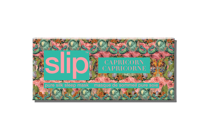 A floral patterned slip silk sleep mask packaging box with Capricorn star sign details.