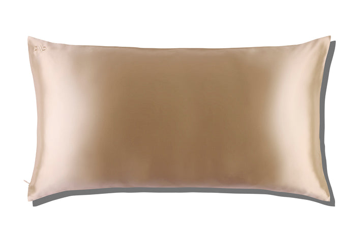 Caramel slip silk king pillowcase on a white background.