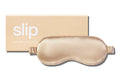 A caramel slip silk sleep mask with branded box on a white background.