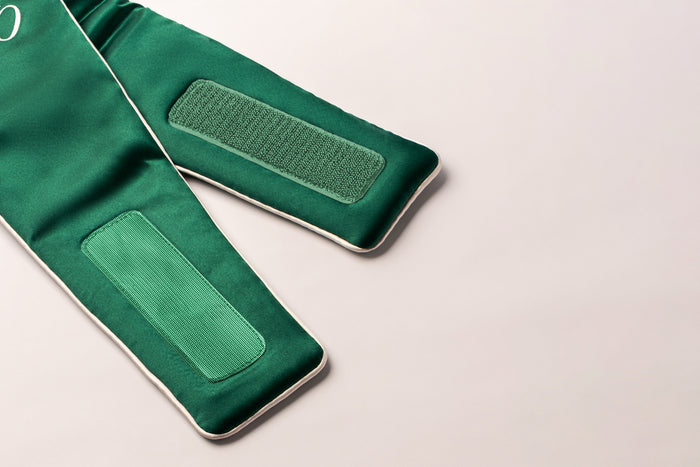 Up close of green hook and loop or 'velcro' fastening of the blockout sleep mask.