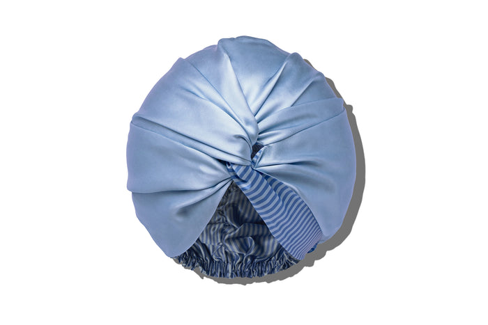 Light blue silk turban on a white background