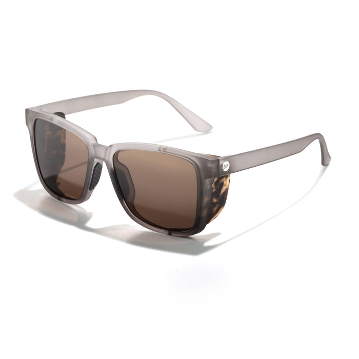 Sunglasses with tortoiseshell frame and brown lenses on a white background