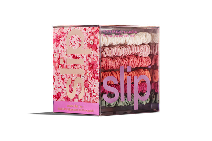 Daisy slip silk skinny scrunchies packaging with florals on a white background.