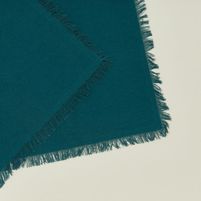 Close up view of essential cocktail napkin in peacock