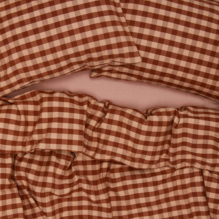 Essential Gingham Pillowcases, Set of 2 - Blush/Terracotta on bed with matching duvet