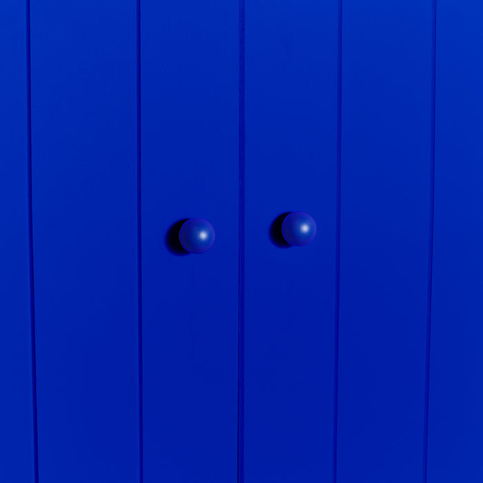Small essential knobs in klein blue on cabinet doors