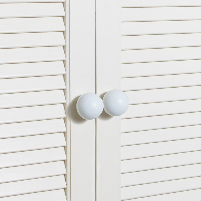 Large essential knobs in white on cabinet