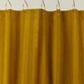 Essential striped shower curtain in mustard / bronze