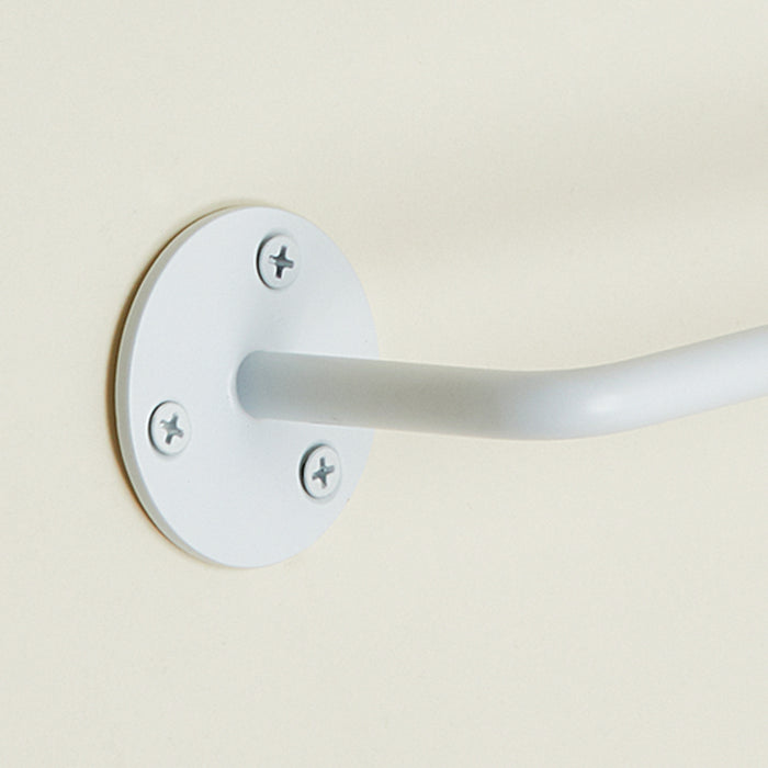 Close up view of essential toilet paper holder in white.