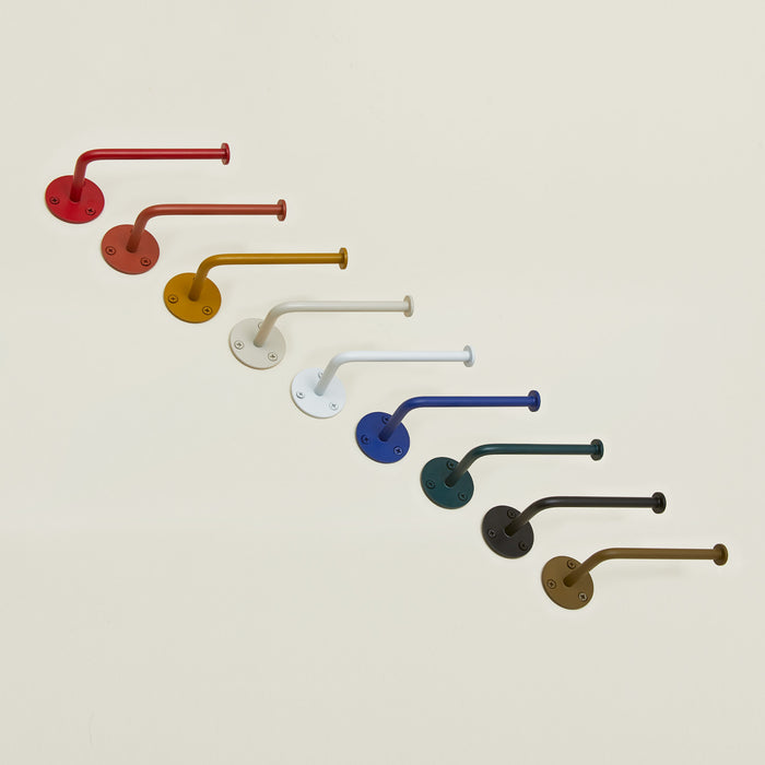 Toilet paper holders in a variety of colors.