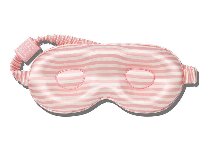 A white and pink stripe slip silk contour sleep mask designed to protect delicate eyelash extensions, on white background.