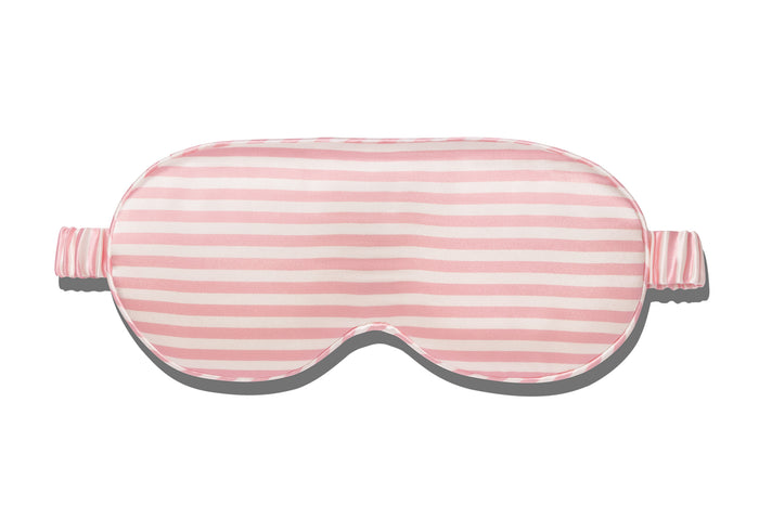 A white and pink stripe slip silk contour sleep mask designed to protect delicate eyelash extensions, on white background.