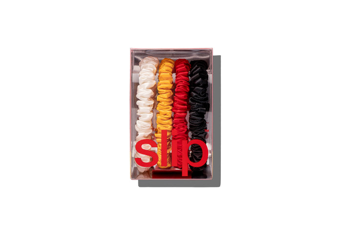 Set of colorful scrunchies in a box with slip® branding on a white background