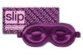 A dark purple slip silk contour sleep mask designed to protect delicate eyelash extensions, with the brand name 'slip' visible on the packaging.