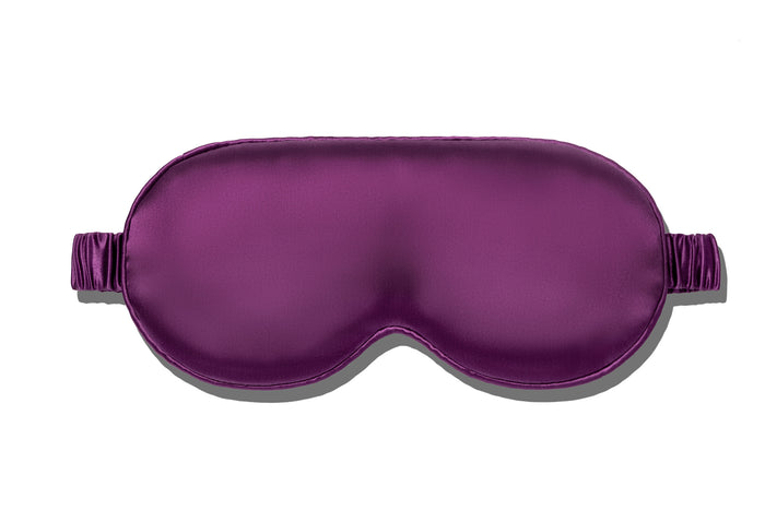 A dark purple slip silk contour sleep mask designed to protect delicate eyelash extensions, on white background.