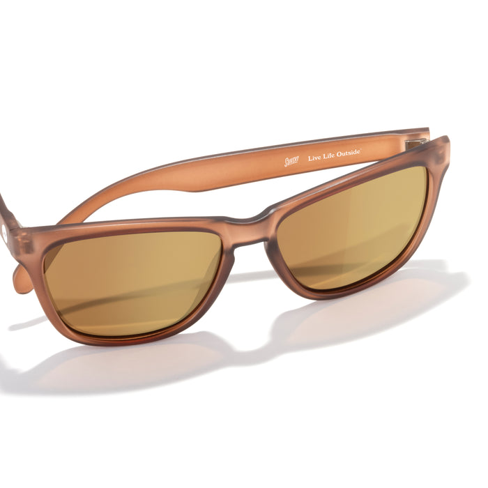 Brown sunglasses with a reflective surface on a white background
