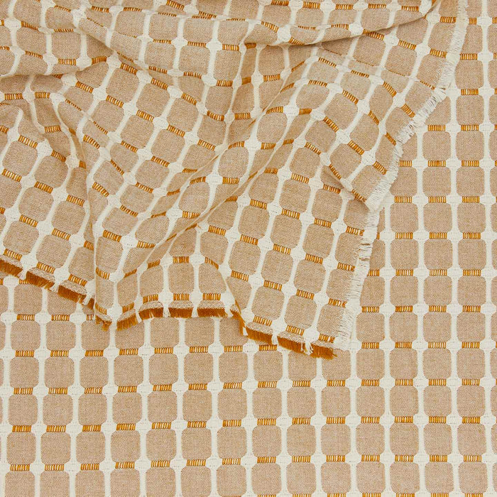 close up view of Dove and Donkey hopsack tablecloth in honey