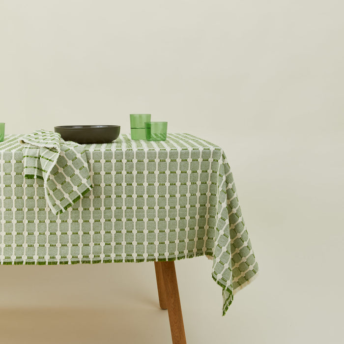 Dove and Donkey hopsack tablecloth in leaf with place setting