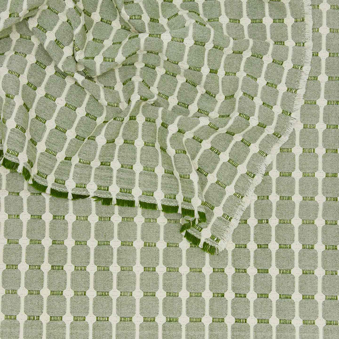 Close up view of Dove and Donkey hopsack tablecloth in leaf