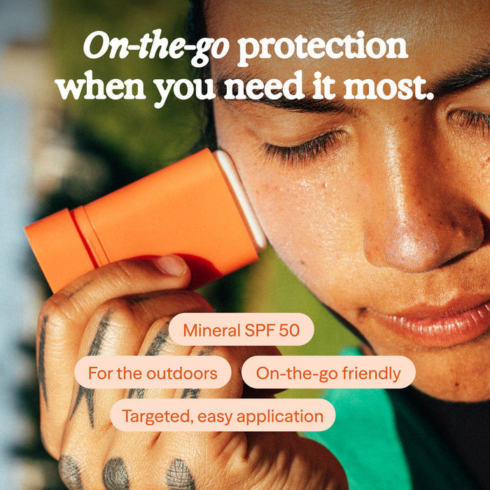 Person holding an orange SPF product with text about protection and features.