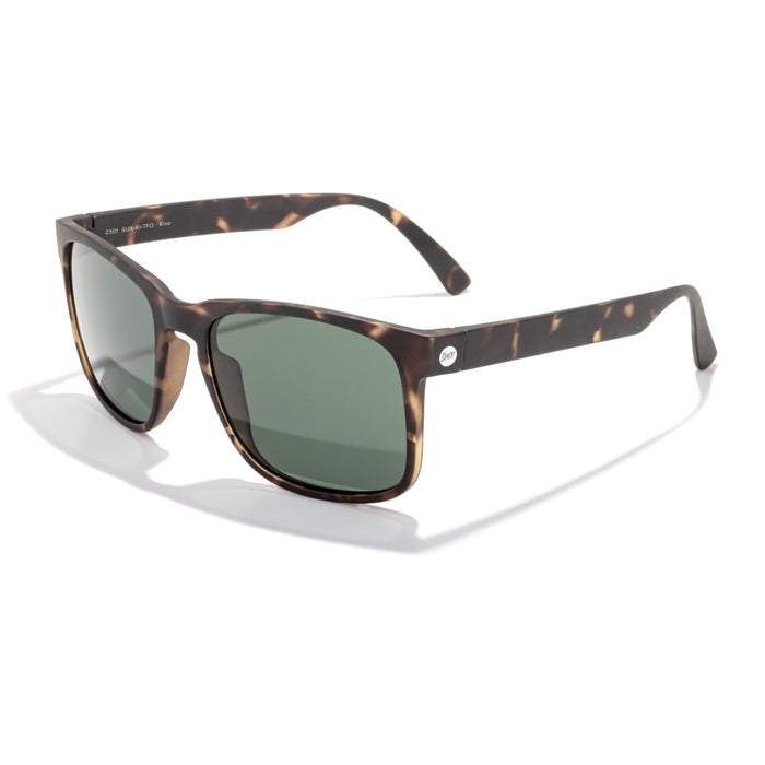 Sunglasses with tortoiseshell frame and dark lenses on a white background