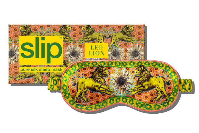 A colorful slip silk sleep mask with a zodiac Leo design, featuring yellow and gold tones, and a matching box packaging.