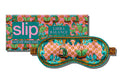 A floral pattern with scale graphic on a slip silk sleep mask for the Libra star sign. Displayed in front of branded packaging on a white background.