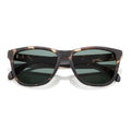 Sunglasses with tortoiseshell frame and dark lenses on a white background