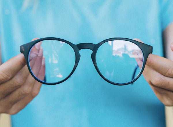 RICH sunski mini dipsea blue light hands holding glasses
