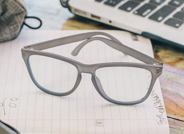 RICH sunski mini headland blue light glasses resting on notebook
